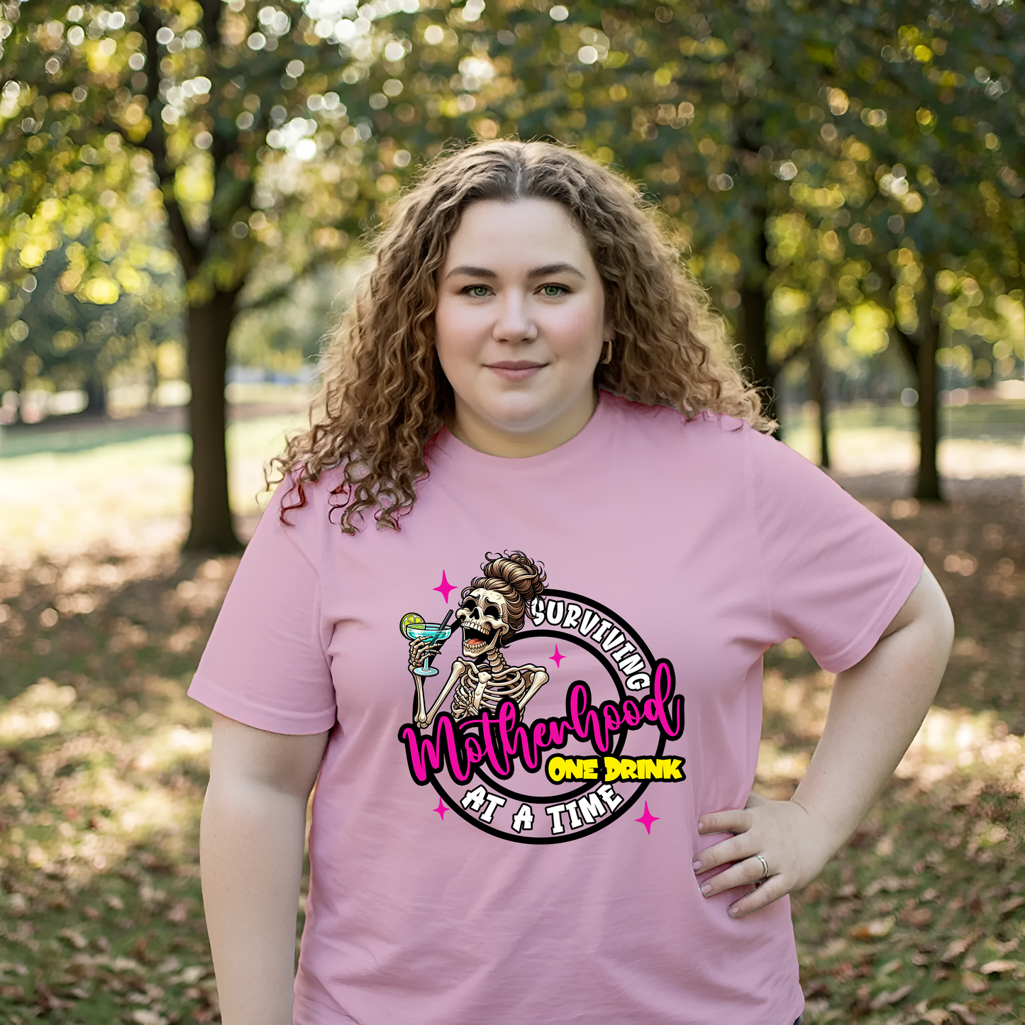 Surviving Motherhood One Drink at a Time Tee – Funny Skeleton Mom Shirt | Humor Graphic for Moms | Unisex Fit